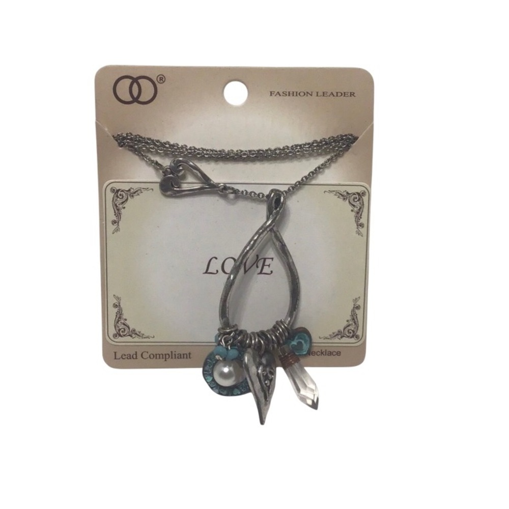 “Love” necklace featuring multiple charms on silver tone loop